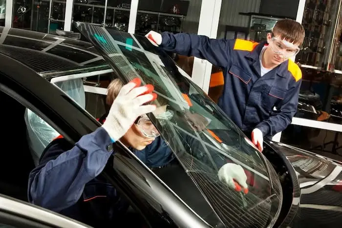 Professional windscreen replacement technician working on car in Sydney - Mr Advanced Windscreens